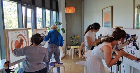 Beginners using tufting guns during a guided rug tufting workshop at Craft Studio London