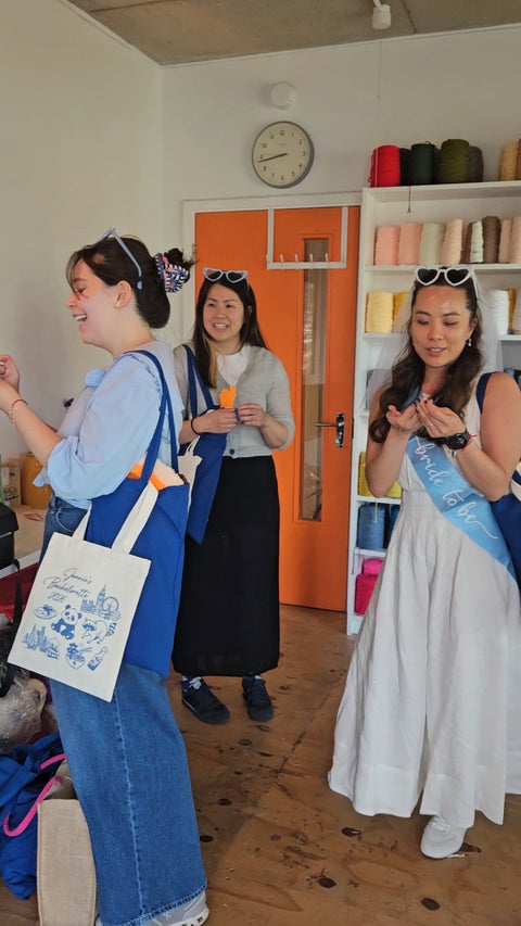 Hen party guests enjoying a private tufting workshop inside Craft Studio London.