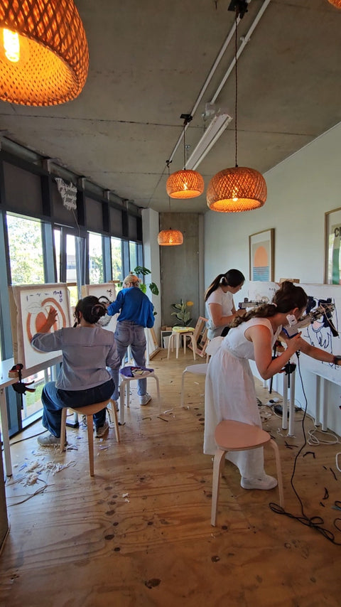 Hen party guests making rugs during a private tufting workshop at Craft Studio London